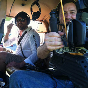 Cameraman and Director in helicopter fo video shoot